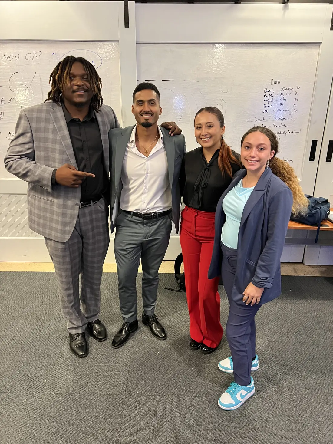 Team members in business attire during a strategy session at the office
