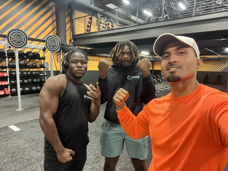 Team members training together at the gym