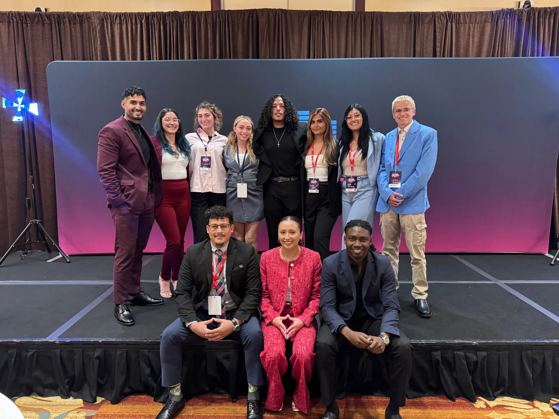 The Inti Empire Group team together on stage at an awards event